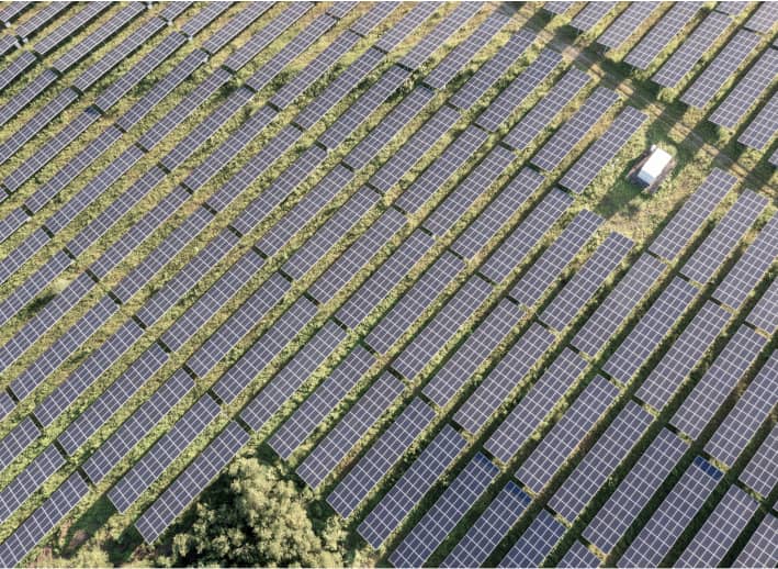 An aerial view of over 30 solar panels